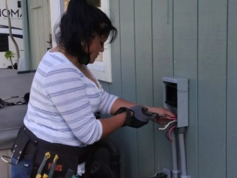 Licensed electrician wiring an exterior subpanel in Eureka